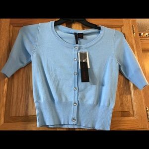 Light blue short sleeve mid body cardigan.